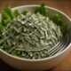 AI-generated image: a salad full of chopped-up one-dollar bills. GPT-1, Firefly V3, et al.