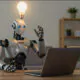 AI-generated image: A robot sits in front of a laptop and a 'Eureka!' light-bulb lights up over its head. Z-Image, Qwen Edit (509), and Firefly V3