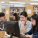 AI-generated image, using Z-Image Turbo via Krita AI diffusion, with the prompt: 'A university library with male and female students engrossed in their computers, stock image'.