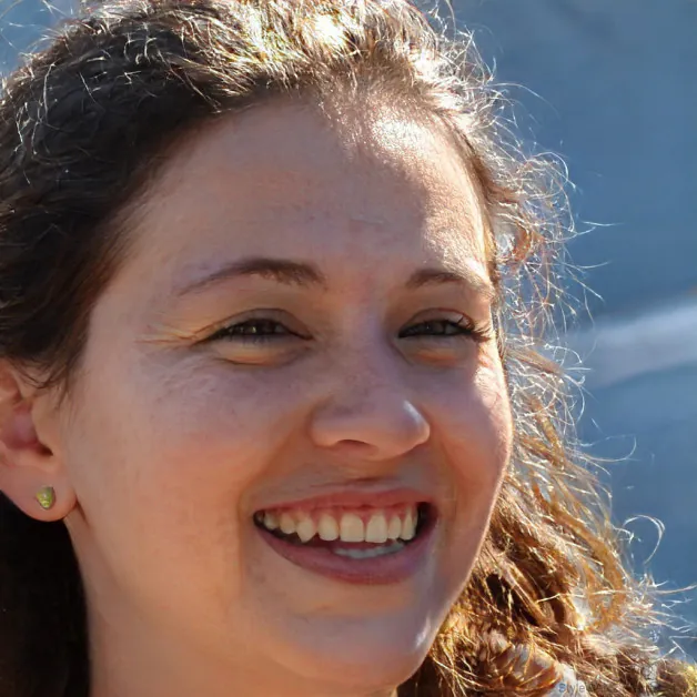 An AI-generated photo of a woman outside.