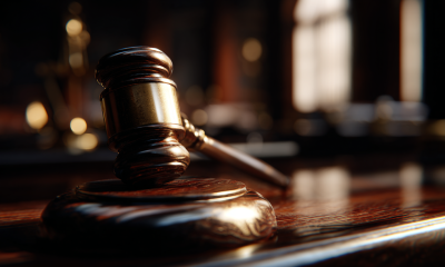 Closeup of a judge's gavel in a courtroom.