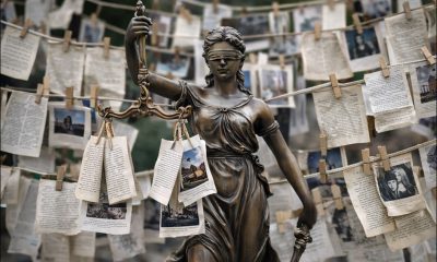 An AI-generated image of Lady Justice surrounded by 'laundered' data. GPT-1.5.
