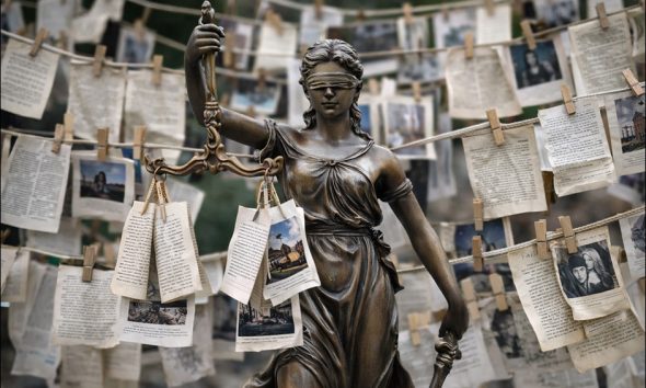 An AI-generated image of Lady Justice surrounded by 'laundered' data. GPT-1.5.