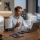 A photorealistic depiction of a modern executive at a desk, energized and focused, with multiple holographic document drafts—slides, spreadsheets, and text blocks—floating and layering around his laptop, symbolizing high-volume iterative work.