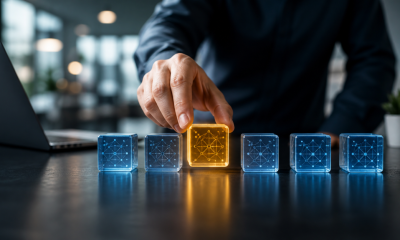 Hand selecting a glowing AI model cube from multiple options in a modern tech office, symbolizing strategic AI model selection.