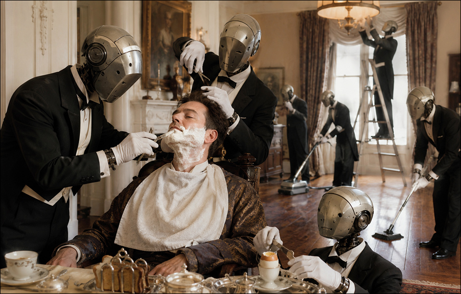 AI-generated image (GPT-2): A man sits at breakfast while a group of identical domestic robots shave him, cut his hair, prepare his food, and clean the house around him, turning even the smallest daily tasks into outsourced labor.
