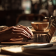 Closeup of a writer's hands typing on a laptop.