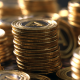 Closeup of stacks of gold tokens.