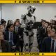 AI-generated image (GPT-2): a photorealistic visualization of a humanoid industrial robot evaluating a room of anxious job applicants, illustrating the paper's exploration of demographic bias in AI-assisted hiring. The warning border indicates that the scene is fictional and not a depiction of events described in the research.