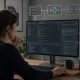 Woman developer reviewing code with an AI-assisted software workflow