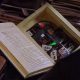 Screen capture from The Matrix (1999), featuring 'warez' on optical media, hidden inside a book, about to be sold to a willing buyer. © Warner Bros. Used for commentary and illustrative purposes.