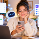 A woman sitting at a desk and using Poke AI to handle her emails, calendar, and other daily tasks from her phone.