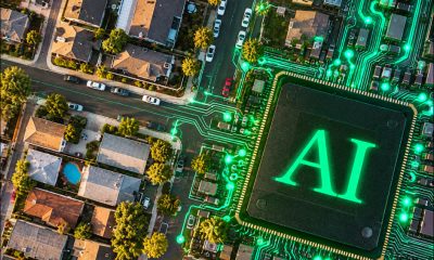Illustration depicting 'AI' associated with a suburban neighborhood. created in Photoshop using https://unsplash.com/photos/aerial-photography-of-city-during-daytime-IZypSha074U and https://unsplash.com/photos/glowing-ai-chip-on-a-circuit-board-w69Z8K-HGQU under the Unsplash license in each case. The image has then been enhanced in GPT Image 2.
