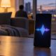 Smartphone on a table showing an abstract voice waveform