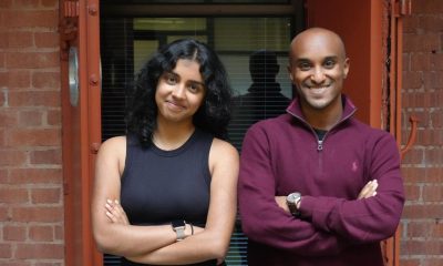 Colare co-founders Esther Thomas, left, and Nain Abdi, right, standing outside a brick building.