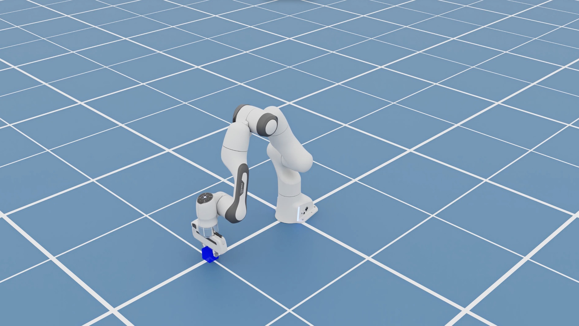 A simulated Franka robot arm reaching toward a blue block on a grid, supplied by CoreWeave.