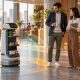AI-generated conceptual illustration of a service robot coordinating with people; not an actual GMEX robot.