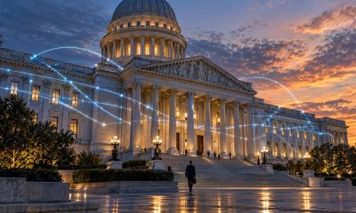 Neoclassical government building at dusk with glowing data lines across the facade
