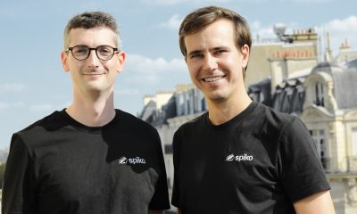 Spiko co-founders on a Paris rooftop wearing Spiko-branded shirts.