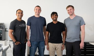 Warp Sciences co-founders standing together in a chemistry laboratory