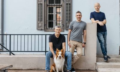 Zenzap’s three co-founders pictured outdoors with a dog