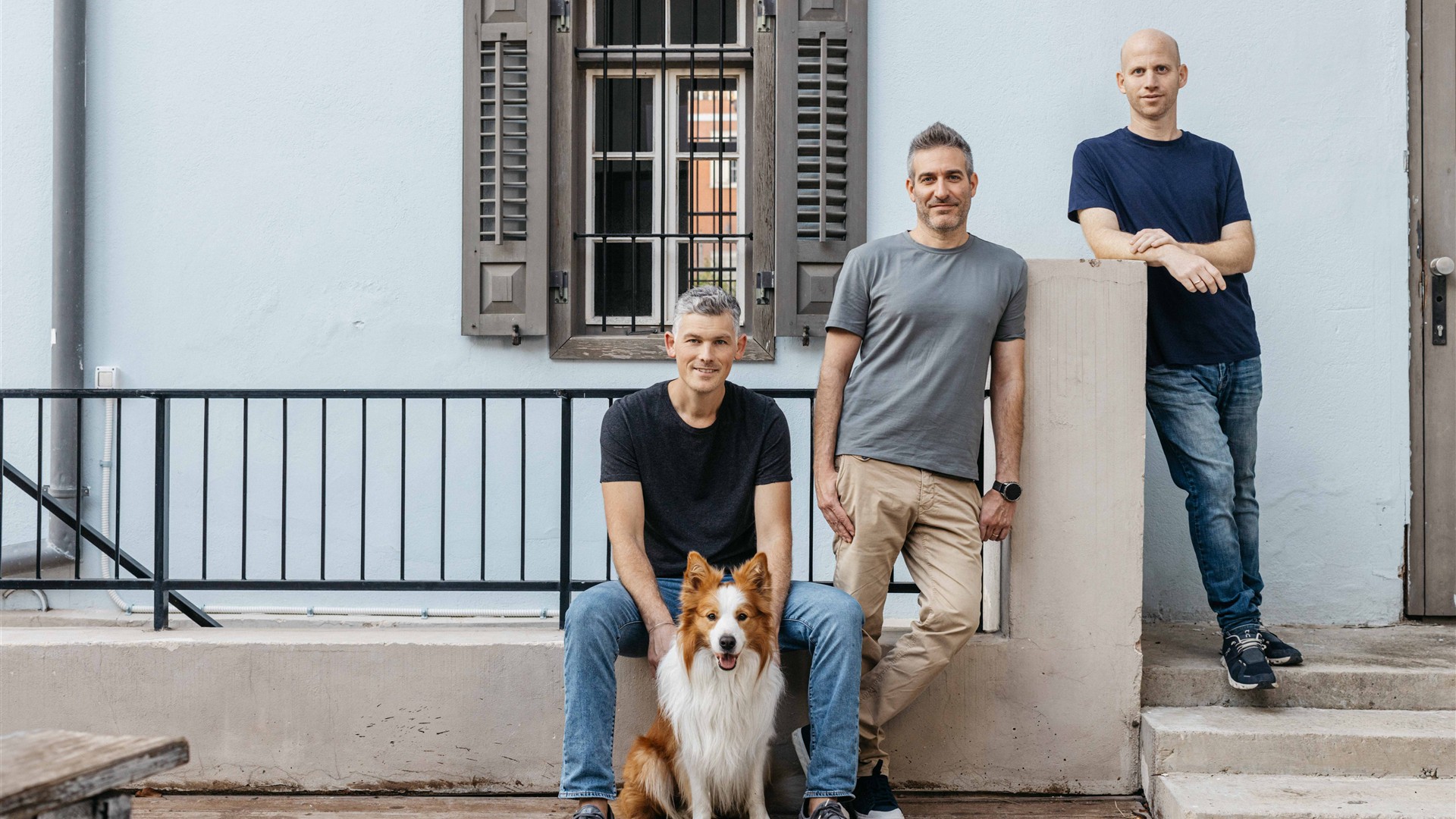 Zenzap’s three co-founders pictured outdoors with a dog